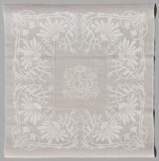 Linen damask handkerchief with marguerite design and in the center a crowned coat of arms with a lion