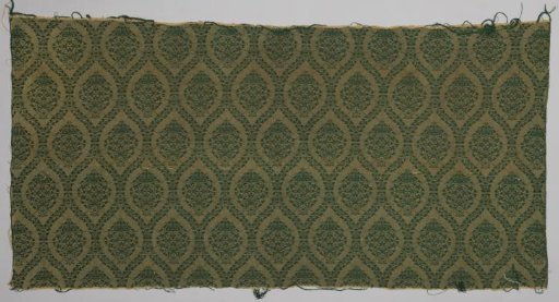 Upholstery fabric, jacquard weave with pattern of pointed oval fields with leafy vines, dark green weft on soft yellow warp