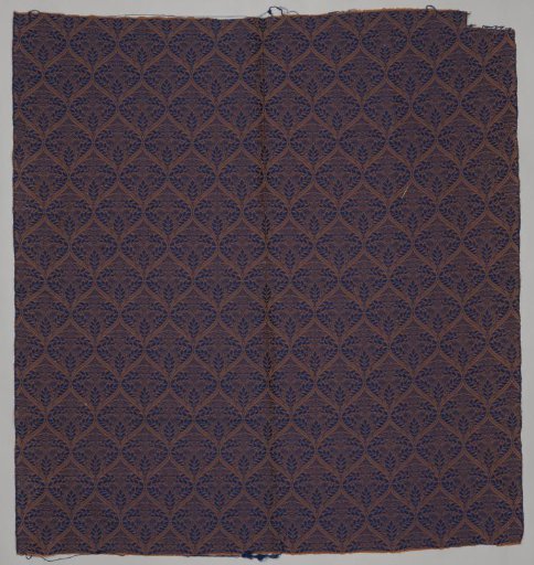 Upholstery fabric, jacquard weave with pattern of pointed ovals with leafy branches, blue on mocha brown