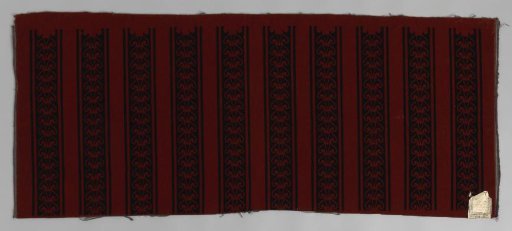 Printed tripe with pattern of vertical, ornamental bands in black on brown-red