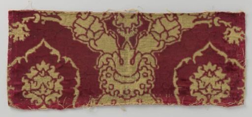 Fragment of red velvet brocade with pomegranate motif in gold