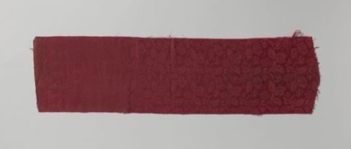 Fragment of red silk damask