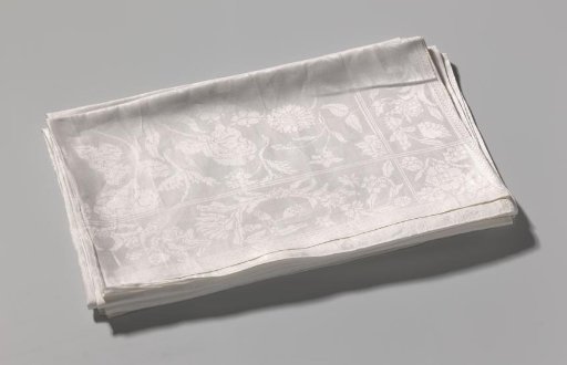 Damask table runner composed of two parts with a floral pattern