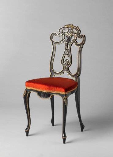 Chair, painted alternately glossy and matte black, decorated with gilded edges and some gold-colored metal fittings. Upholstered in orange velvet