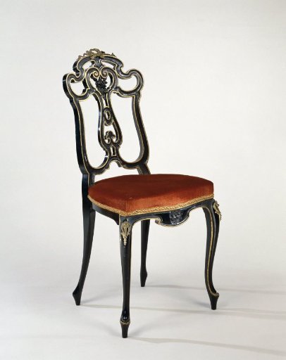 Chair, alternately glossy and matte black painted and decorated with gilded edges and some gold-colored fittings. Upholstered in orange velvet.