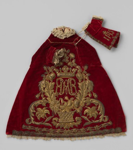 Mantle for the Christ Child, of red velvet with an embroidered IHS monogram