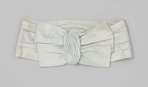 Belt of light blue silk satin; a bow is sewn at one end of the pleated belt