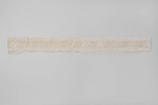 Skirt hem of tulle embroidered with white beads