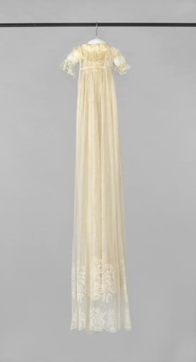 A christening dress of tulle with stuffing work and white silk