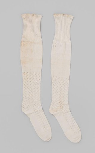 Stocking of white cotton openwork knitting, with a plain section at the calf and a wide border at the top