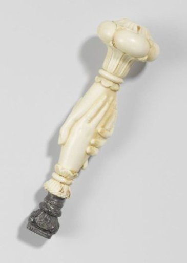 Ivory stamp, carved in the form of two clasped hands