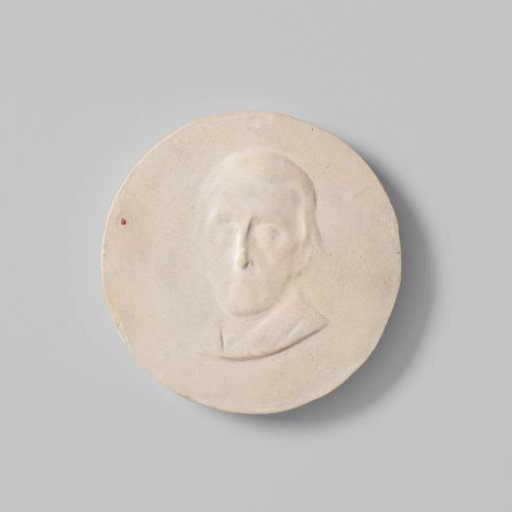 Cast of a design for a medal with a male portrait