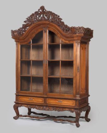 Display case with heavy upper structure and doors divided by muntins, on a very low wide base with four stout curved legs connected by an X-shaped cross, carving, partially openwork, with floral, leaf, and rocaille work