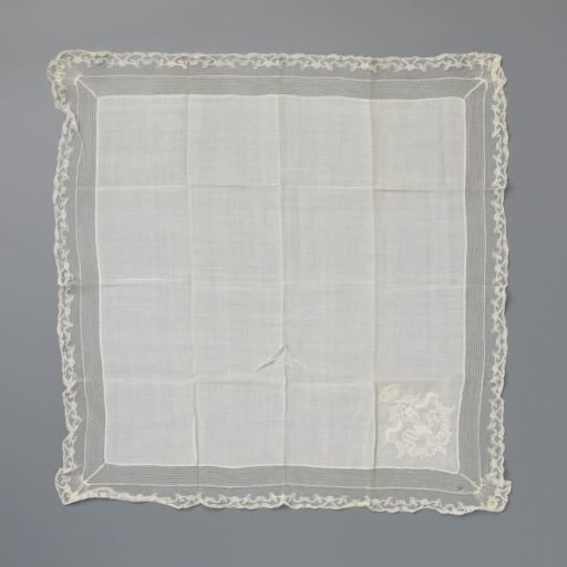 Handkerchief of batiste with embroidered crown above the initials MH and a border of machine lace and bobbin lace