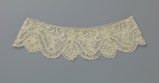 Cuff of needle lace with wavy zigzag border and rose branch