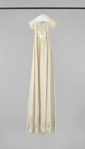 A baby dress, so-called long dress, of white cotton with openwork embroidery, with a bodice of batiste