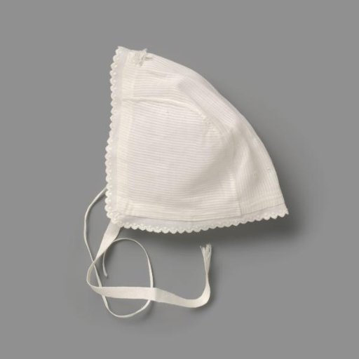 Children's cap of striped cotton and batiste, trimmed with a scalloped festooned edge with knots; two ribbon ties