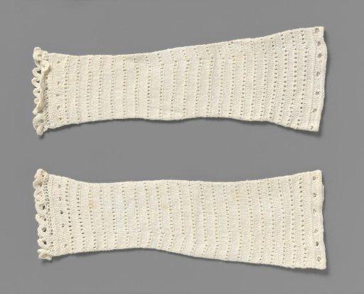Mitten of white knitted cotton with openwork horizontal stripe, shell border and eyelet border for buttonhole tape