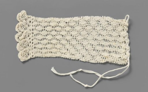 Mitten of white crocheted cotton
