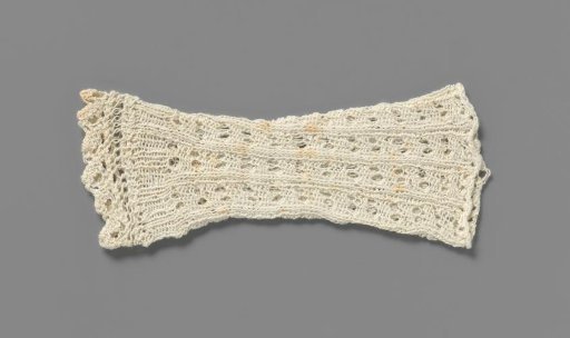 Mitten of white knitted cotton in openwork pattern