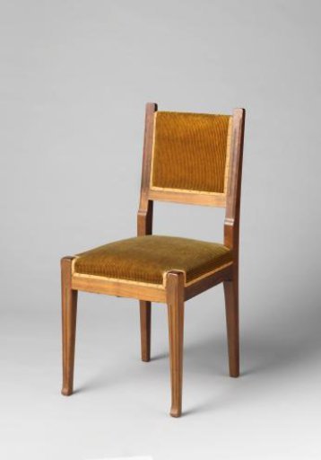 Chair upholstered in black-striped brownish-yellow leather
