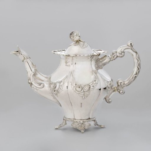 Silver teapot, six-lobed body on four legs in the form of curved branches. S-shaped curved spout, C-shaped curved handle.