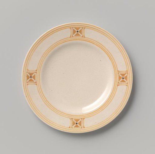 Cake plate decorated with block pattern and dots in yellow and black