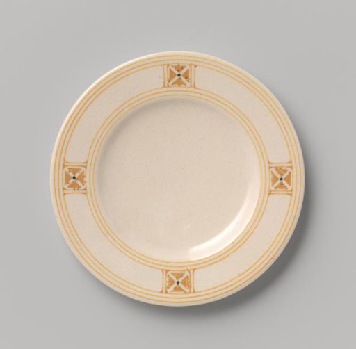 Cake plate decorated with block pattern and dots in yellow and black