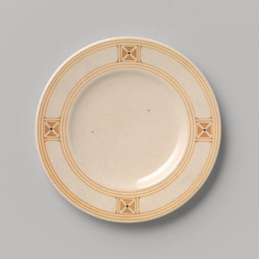 Cake plate decorated with a block pattern and dots in yellow and black