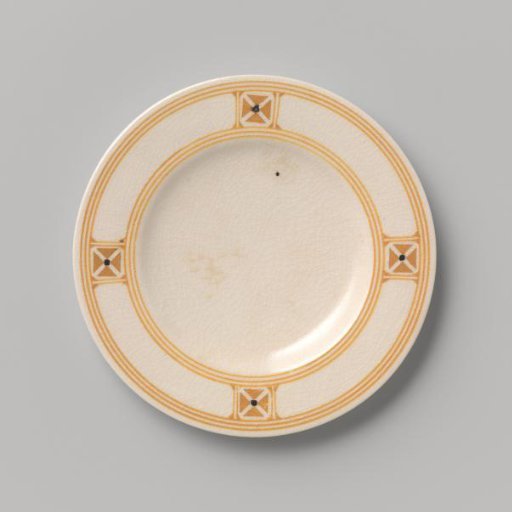 Cake plate decorated with a block pattern and dots in yellow and black