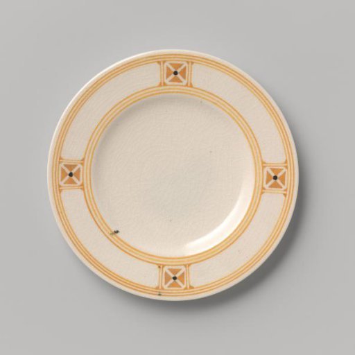 Cake plate decorated with block pattern and dots in yellow and black