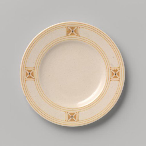Cake plate decorated with block pattern and dots in yellow and black