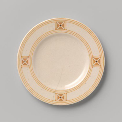 Cake plate decorated with block pattern and dots in yellow and black