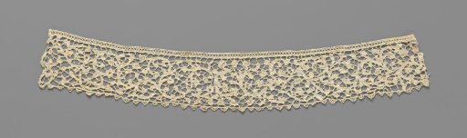Strip of needle lace with C-shaped scrolls