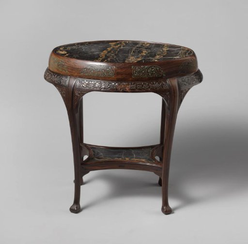 Table in an oval shape with curved legs