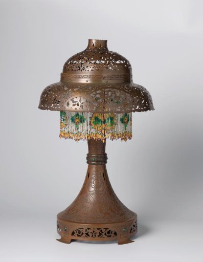 Taper with openwork motifs