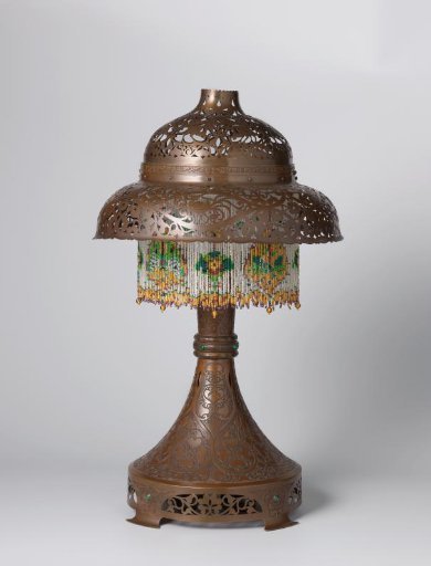 Taper with openwork motifs