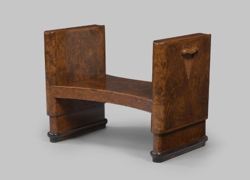 Bench with two closed cheeks, hollowed out at the top and with a wavy handle