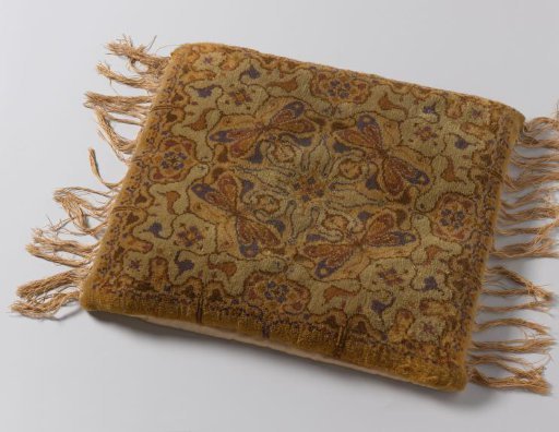 Footstool of Knotted Wool with a Pattern of Four Dragonflies in Fletsgreen, Yellow, Purple and Brown. Design by Th.W. Nieuwenhuis.