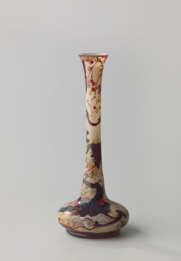 Vase with branches of elder with black berries