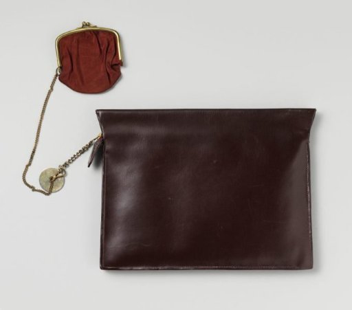 Bag of unadorned dark red leather (?), flat slip-in model with zipper, two sewn-in inner pockets and a coin purse on a chain