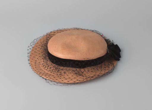 Hat of fine rose straw, trimmed with black ribbon velvet and black voile