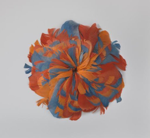 Cockade of feathers in the colours orange and blue in the form of a rosette