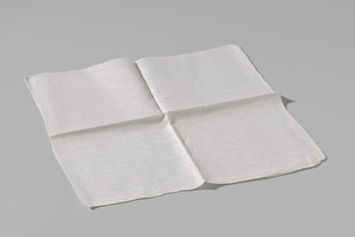 Fragment of a napkin or tablecloth with a cross-stitch pattern