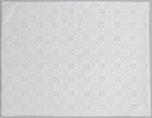 Tablecloth of white linen with pelican pattern