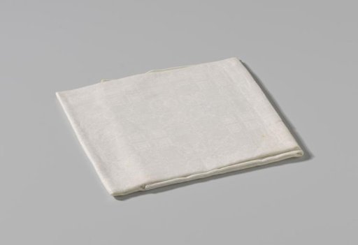 Fragment of a tablecloth of white linen with pelican pattern