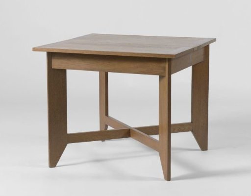 Table resting on four legs placed diagonally