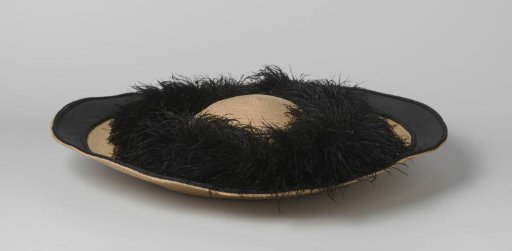 Hat of straw, a brim of black taffeta and black ostrich feathers