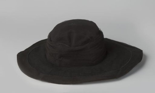 Hat of black tulle with a tuft of red cherries