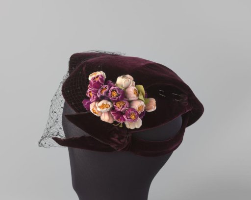 Hat of aubergine-coloured velvet with puffed black voile